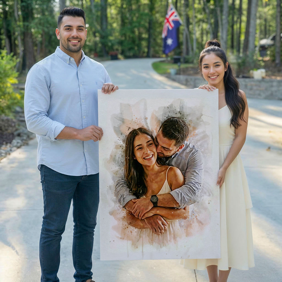 A smiling couple standing outdoors holding a large custom watercolor effect wall art print from Ausome Love Studio, featuring a romantic portrait of them embracing.