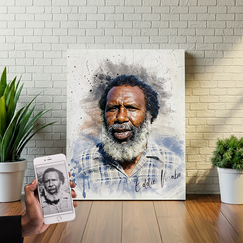 Custom Eddie Mabo watercolor wall art by Ausome Love Studio, featuring a vibrant colorized portrait of the Australian Indigenous land rights activist on canvas, with the original black and white photo shown on a smartphone.