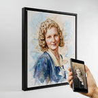 Custom vintage photo restoration watercolor portrait by Ausome Love Studio, featuring a blonde woman with curled hair in a black floating frame, shown next to the original cracked black-and-white reference photo on a smartphone.