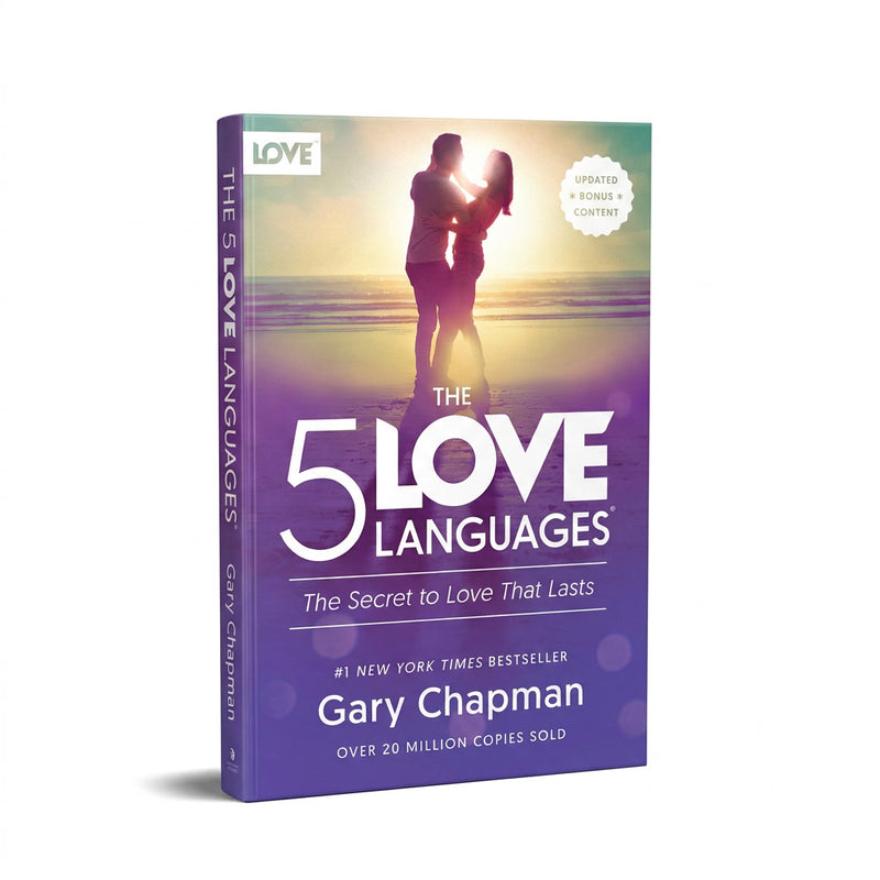 The 5 Love Languages book by Gary Chapman, shown as a 3D paperback mockup on a white background. The cover features a sunset beach scene with a couple silhouette, transitioning into a purple gradient with white text.