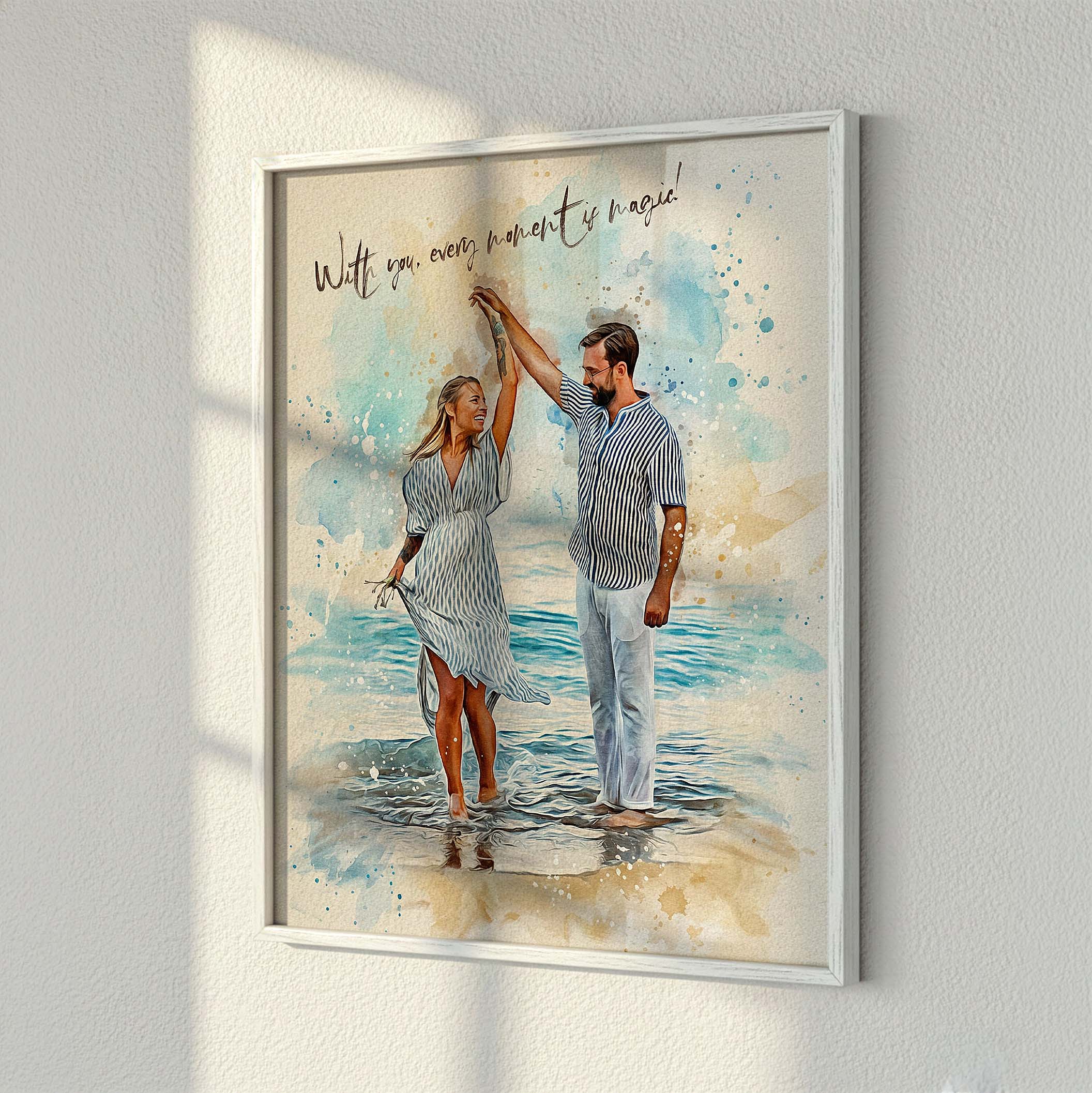 Custom beach vacation portrait by Ausome Love Studio featuring a watercolor effect printed on wall art, showing a couple dancing on the shore in a white frame.
