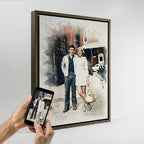 Personalized couple's watercolor effect wall art by Ausome Love Studio, featuring a full-body vintage photo recreated as a high-quality printed canvas in a dark wood frame, held next to the original reference photo on a smartphone.